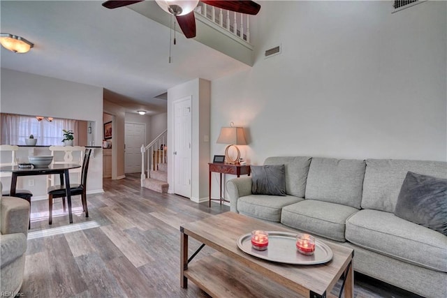 living room featuring hardwood / wood-style flooring and ceiling fan