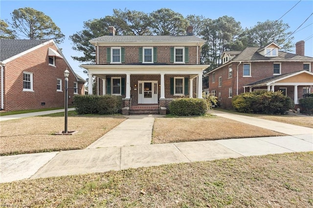 view of front facade featuring a porch and a front lawn