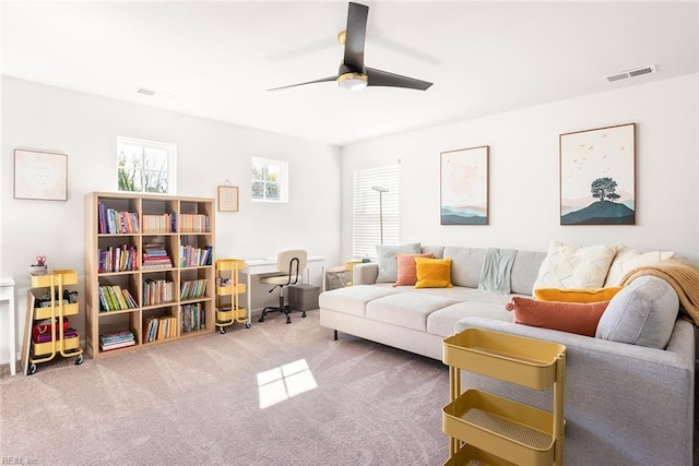 living room with carpet and ceiling fan