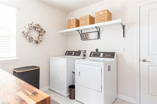 laundry area with separate washer and dryer