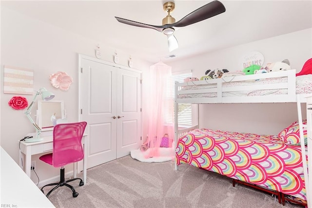 bedroom with ceiling fan, a closet, and light carpet