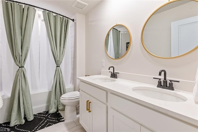 full bathroom featuring vanity, toilet, and shower / bath combo with shower curtain