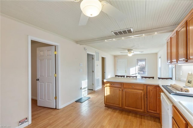 kitchen with ceiling fan, white dishwasher, kitchen peninsula, and light hardwood / wood-style flooring