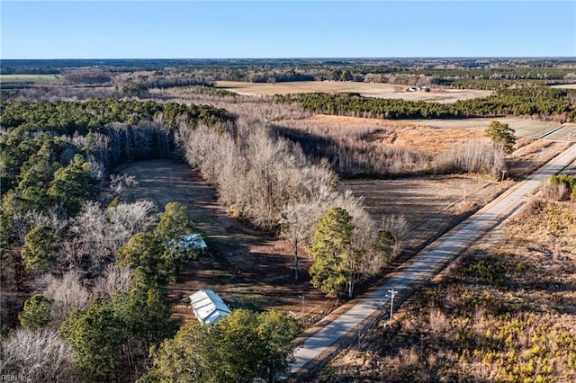 birds eye view of property with a rural view