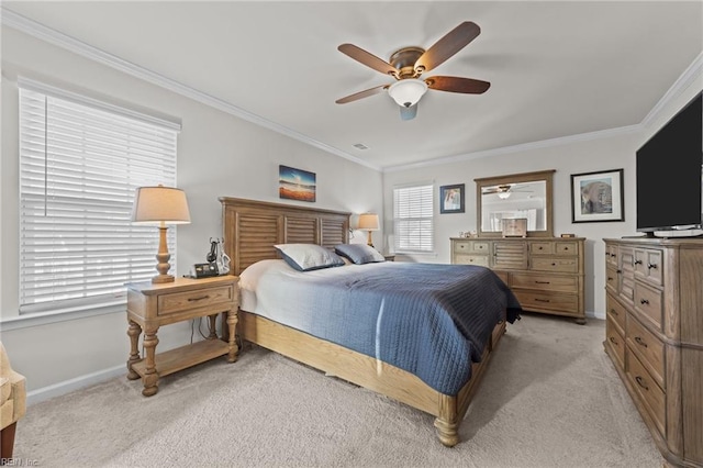 bedroom with crown molding, light carpet, and ceiling fan