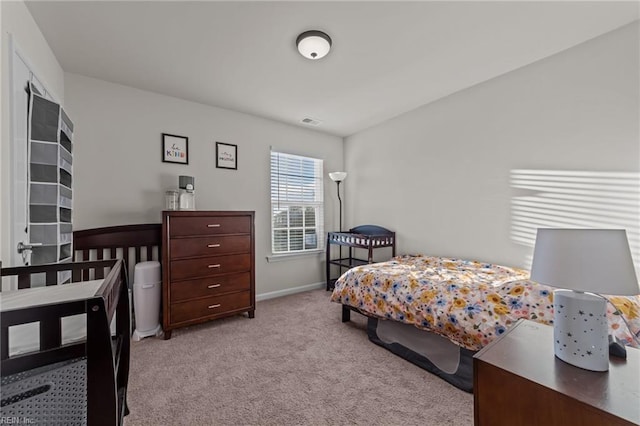 bedroom with light carpet