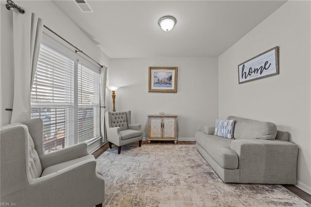 sitting room with hardwood / wood-style flooring