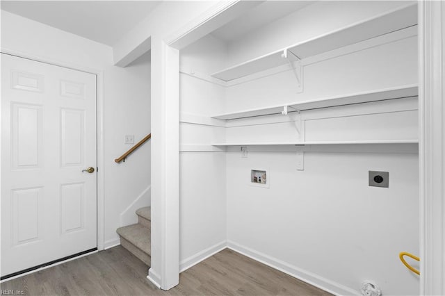 laundry room featuring washer hookup, hardwood / wood-style flooring, and electric dryer hookup