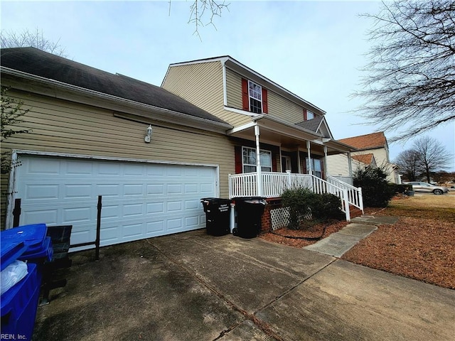 view of front facade featuring a garage and covered porch