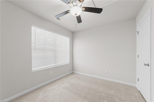 carpeted empty room with ceiling fan