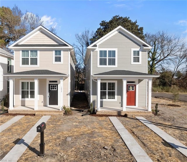 view of property featuring covered porch