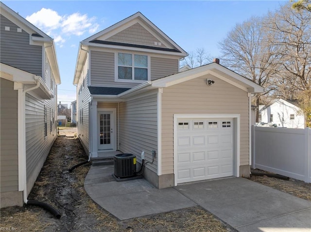 exterior space featuring central AC and a garage