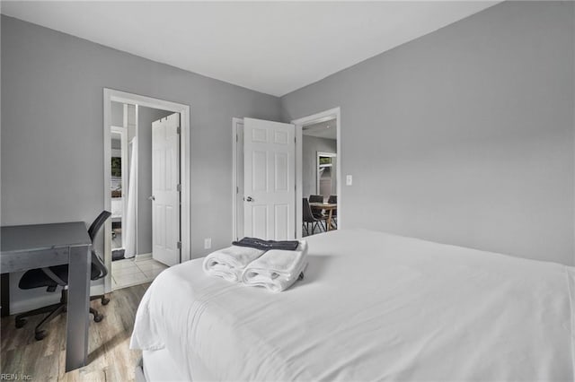 bedroom with light wood-type flooring