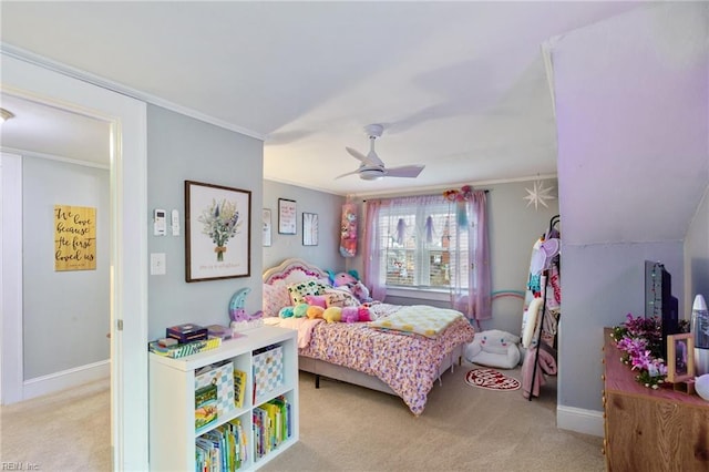 carpeted bedroom with ceiling fan and ornamental molding