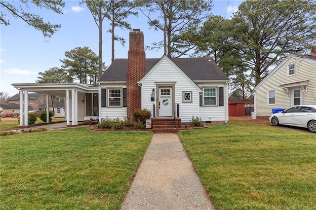 view of front of home featuring a carport and a front yard