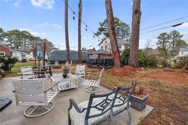 view of patio / terrace with an outdoor fire pit