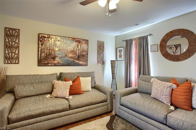 living room with ceiling fan and hardwood / wood-style floors