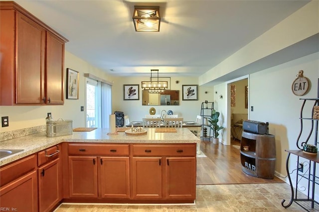 kitchen featuring kitchen peninsula and decorative light fixtures