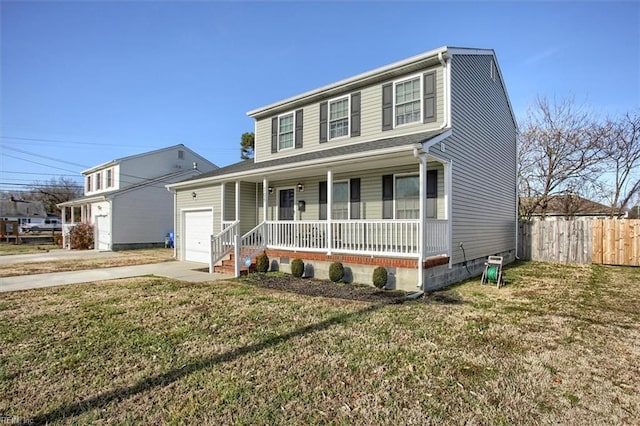 view of front of house with a garage, a front yard, and covered porch