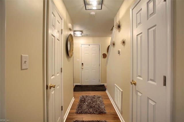 doorway to outside featuring dark hardwood / wood-style flooring