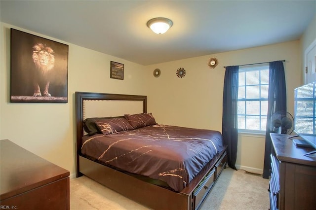 bedroom featuring light carpet