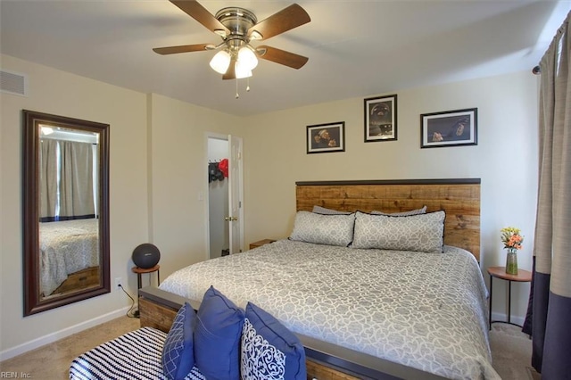 bedroom with ceiling fan and light carpet