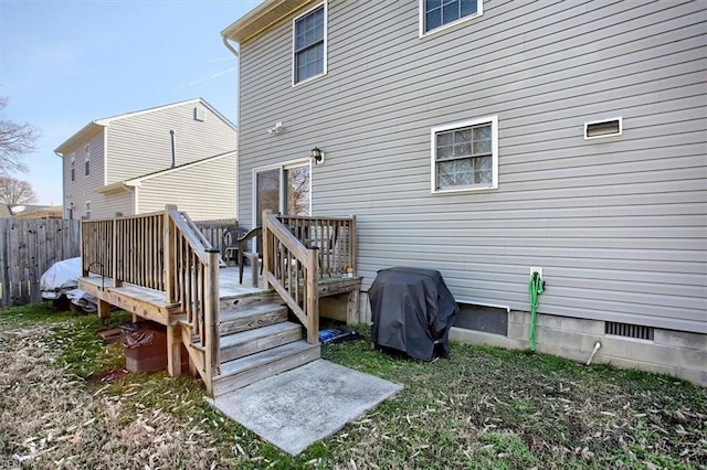 back of house with a wooden deck