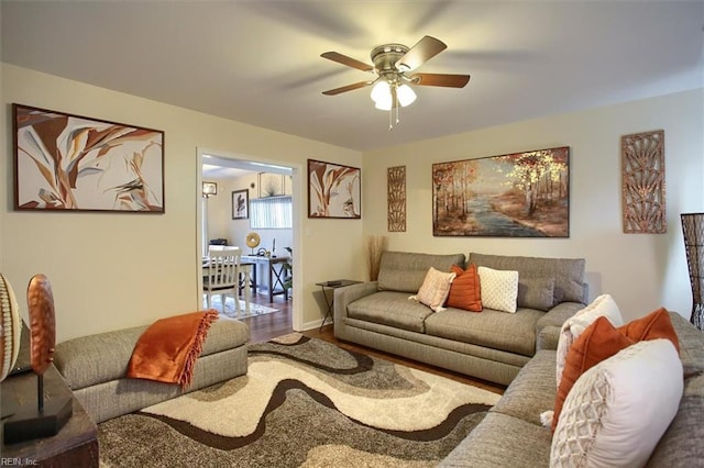 living room featuring hardwood / wood-style flooring and ceiling fan