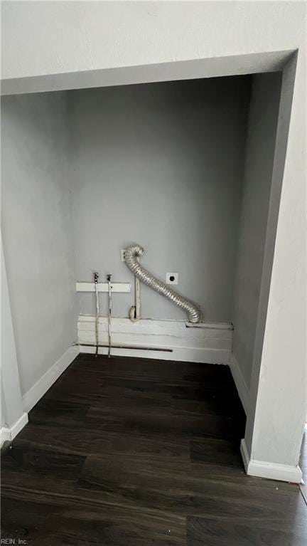 washroom featuring electric dryer hookup, washer hookup, and dark wood-type flooring