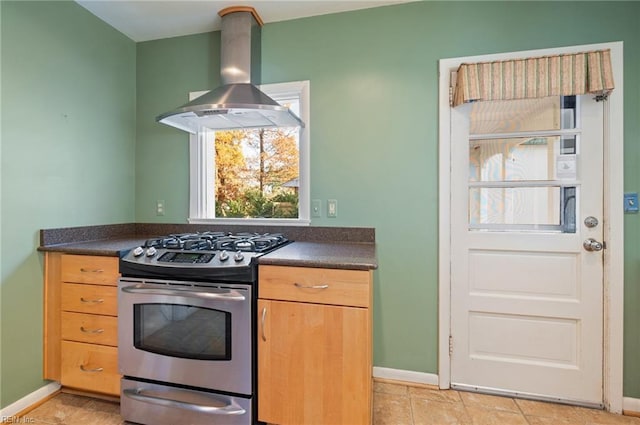 kitchen featuring extractor fan and stainless steel gas range oven