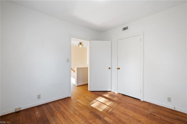 unfurnished bedroom featuring light wood-type flooring