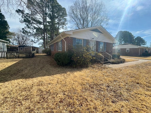 exterior space featuring a front lawn