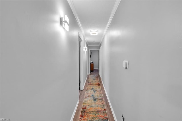 corridor featuring crown molding