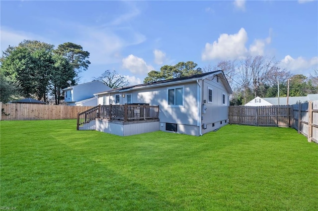 back of property featuring a yard and a deck