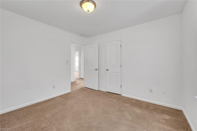 empty room with light colored carpet