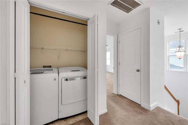 washroom with light carpet and washer and clothes dryer