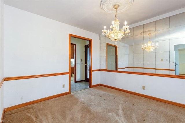 carpeted empty room with an inviting chandelier