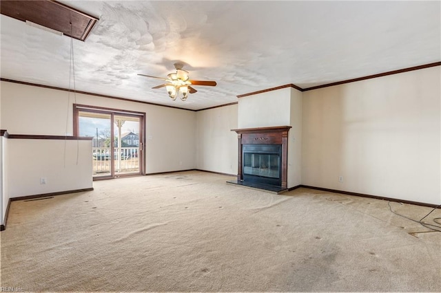 unfurnished living room featuring ornamental molding, light colored carpet, and ceiling fan