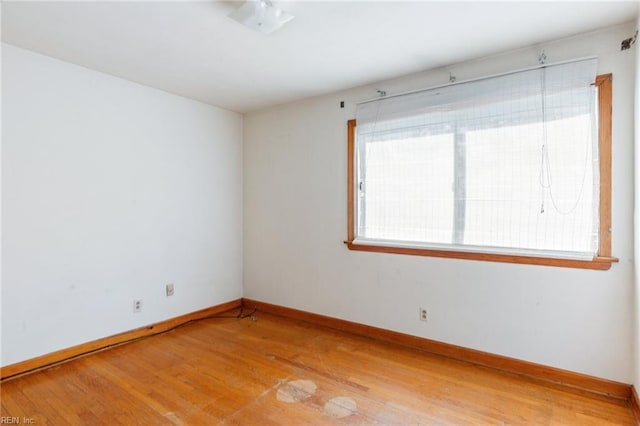 spare room featuring hardwood / wood-style floors