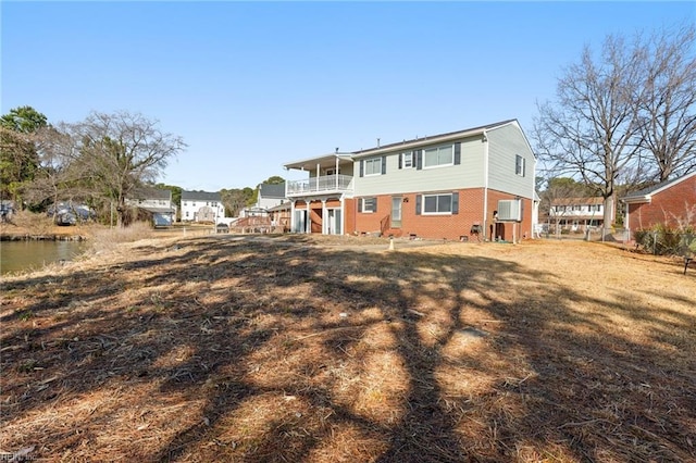 back of property with a water view