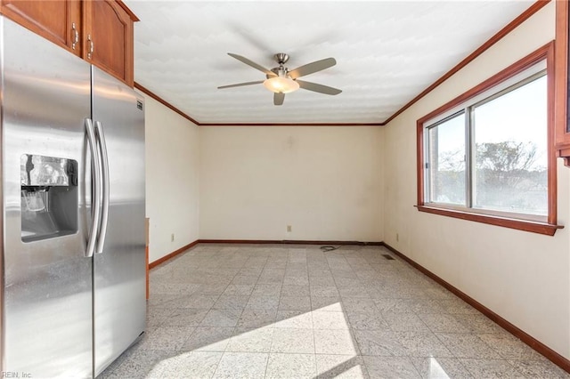 spare room with crown molding and ceiling fan