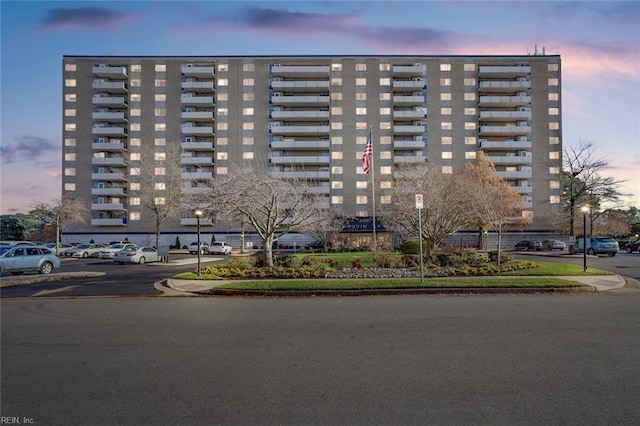 view of outdoor building at dusk