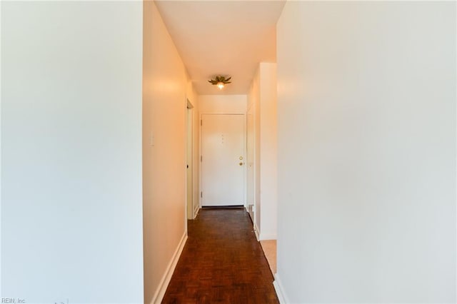 corridor with dark parquet flooring