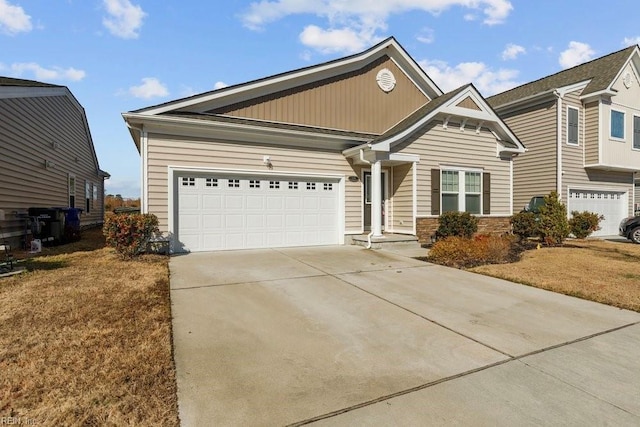 view of front of home featuring a garage and a front yard