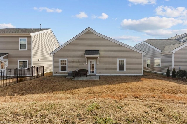 back of property with a patio, a yard, and central air condition unit