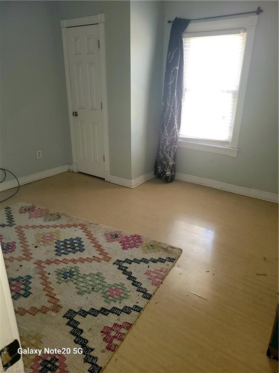 spare room featuring light wood-type flooring