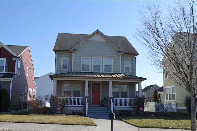 view of front of home featuring a porch and a front yard