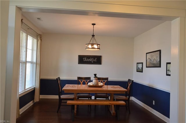 dining area with dark hardwood / wood-style floors