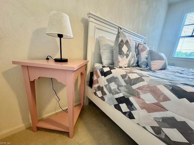 bedroom with light colored carpet