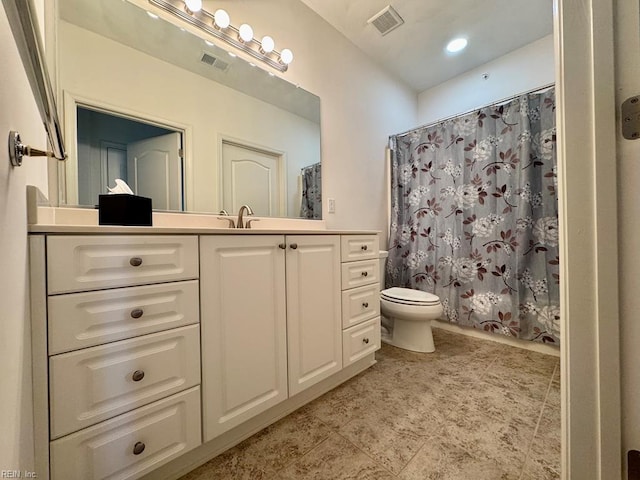 full bathroom with vanity, toilet, and shower / bath combo with shower curtain